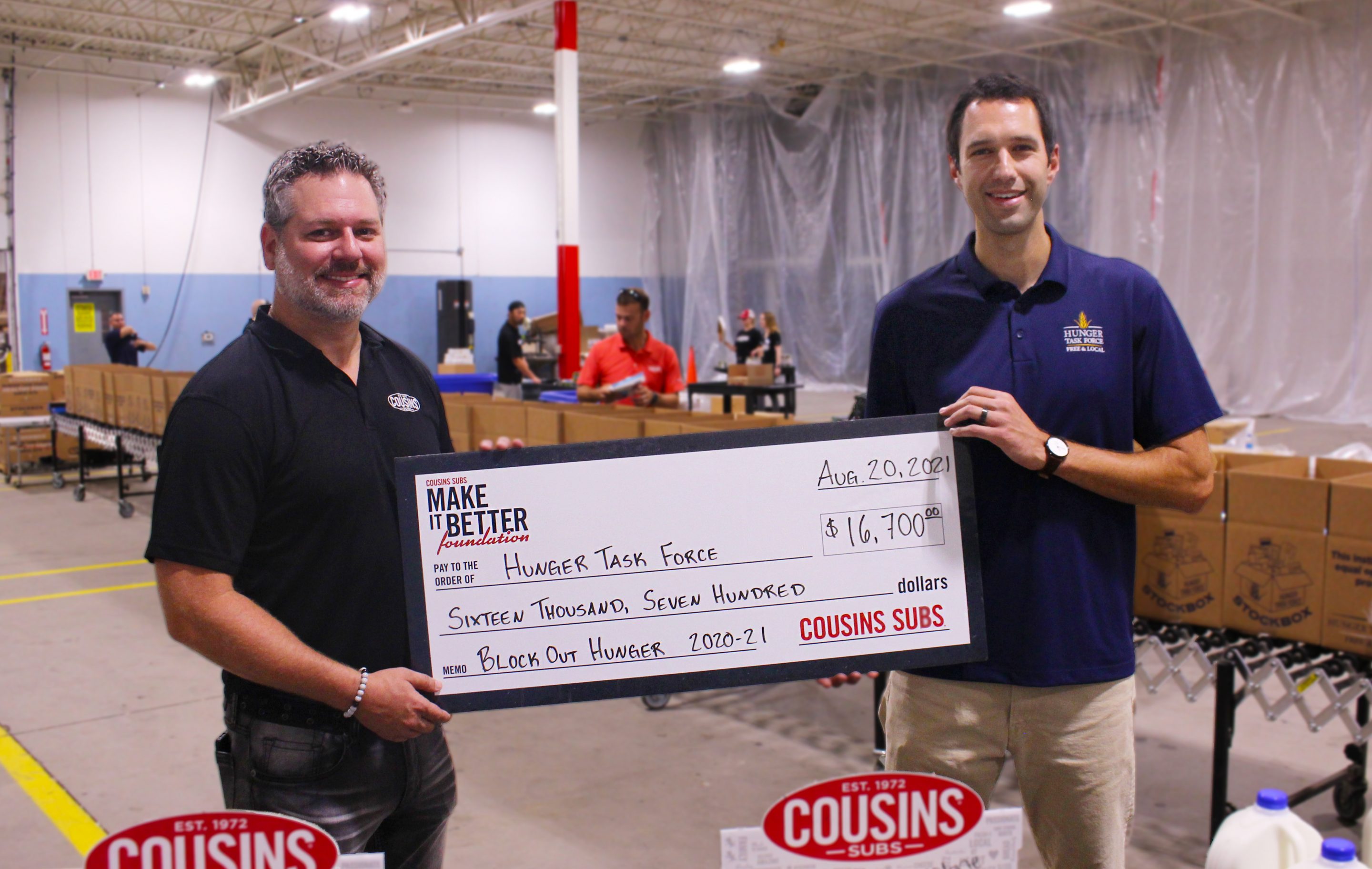 Cousin Subs presents check to Hunger Task Force