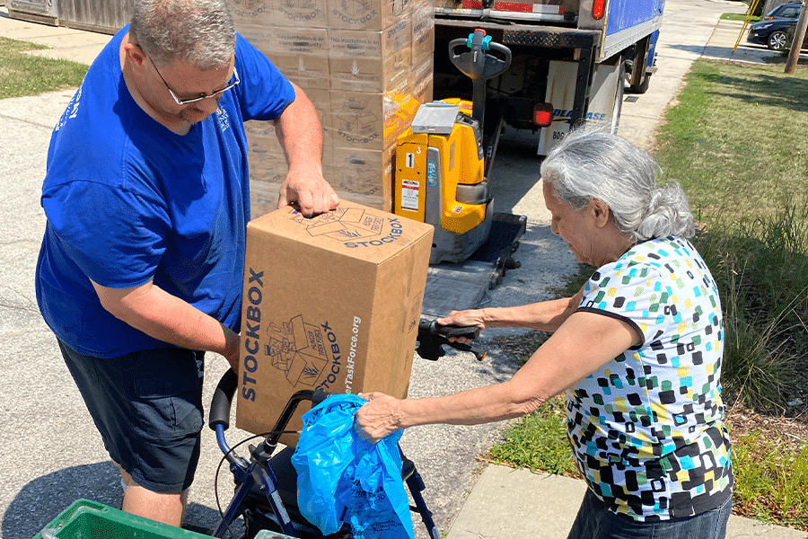 Route Representative assists senior with Stockbox